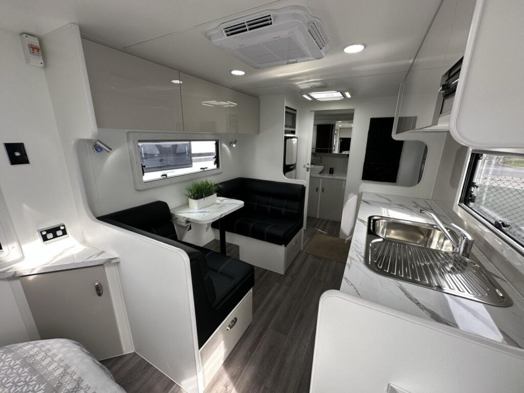 2023 19'6 Paramount Signature Series Rear Door kitchen and living area