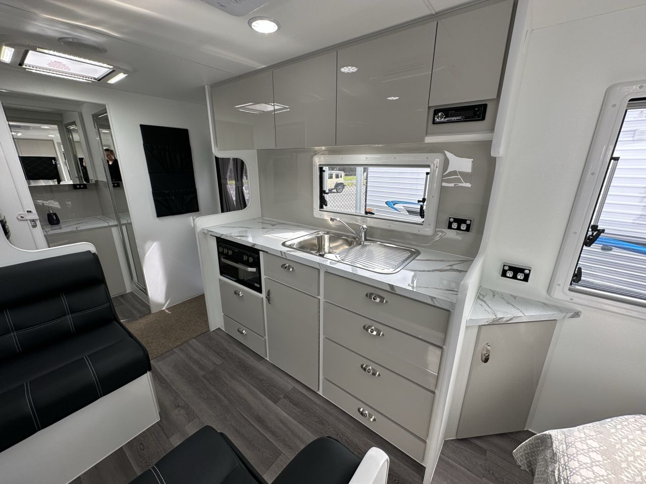 2023 19'6 Paramount Signature Series Rear Door kitchen and living area
