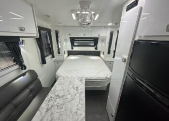 15” Paramount Micro living area and queen bed