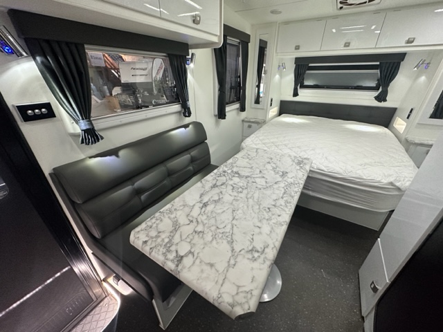 15” Paramount Micro living area and queen bed
