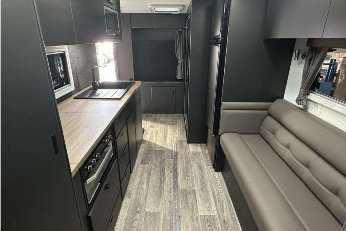 Kitchen and living space in wheelchair accessible caravan