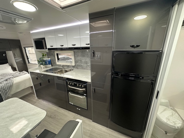 Kitchen and fridge in 2023 Viscount V3.2 Club Lounge caravan