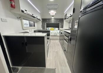 Dining area, kitchen and bed in 2023 Viscount Wildshark V3.5 caravan