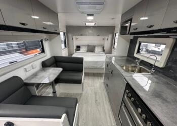 Dining area and kitchen in 2023 Viscount V2 Tandem caravan