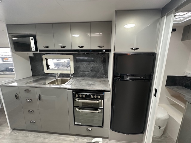 Kitchen and fridge in 2023 Viscount V2 Tandem caravan