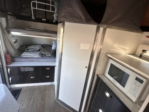 2018 Ezytrail Parks 15 - cupboards next to bunk beds